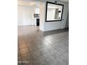 Open-concept living room with tile flooring throughout the house, offering a clean and seamless design at 5975 N 48Th Dr, Glendale, AZ 85301