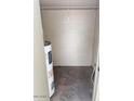 Functional storage space featuring shelves and a water heater, ideal for organizing household items at 5975 N 48Th Dr, Glendale, AZ 85301