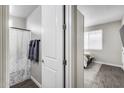Bathroom view from door shows a shower and open door leading to bedroom with natural light at 631 W Winchester Dr, Chandler, AZ 85286
