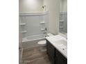 Bright bathroom featuring a tub and shower combination, a vanity, and a toilet at 640 S Maricopa Rd, Florence, AZ 85132