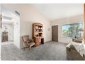 Cozy living room with plush carpet, and an open layout bathed in sunlight at 6424 E Aire Libre Ln, Scottsdale, AZ 85254