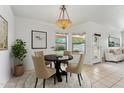 Inviting dining area featuring neutral tones, with a view of the green outdoors at 719 W Milada Dr, Phoenix, AZ 85041