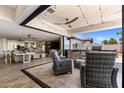 Seamless indoor-outdoor living with access to the outdoor patio, seating, and outdoor kitchen at 7510 E Larkspur Dr, Scottsdale, AZ 85260
