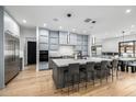Spacious kitchen featuring modern cabinetry, a large island with seating, and stainless steel appliances for the home chef at 7851 N Central Ave, Phoenix, AZ 85020