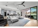 Bright and airy living room with a large sectional sofa, vaulted ceiling, and seamless access to the outdoor patio at 7851 N Central Ave, Phoenix, AZ 85020