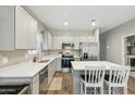 Modern kitchen with stainless steel appliances, white countertops, and a central island at 1281 W Highland Rd, San Tan Valley, AZ 85143