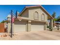 Charming home with a basketball hoop, three-car garage, and desert landscaping at 12813 S 38Th St, Phoenix, AZ 85044
