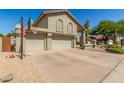 Charming home with a basketball hoop, three-car garage, and desert landscaping at 12813 S 38Th St, Phoenix, AZ 85044