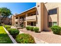 The exterior of this condo has tidy desert landscaping with staircase entryway to the units at 145 N 74Th St # 251, Mesa, AZ 85207
