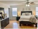 Spacious main bedroom with a ceiling fan and natural light from the window at 218 E Milada Dr, Phoenix, AZ 85042