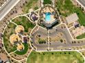 Aerial view of community amenities, including a pool, park, playground, parking, and recreational spaces for residents at 2644 E Grenache Rd, San Tan Valley, AZ 85143