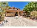 Charming two-story home with a two-car garage, covered entryway, and desert landscaping at 298 W Dana Dr, San Tan Valley, AZ 85143