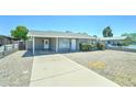 Cozy single-story home with a covered carport and a well-kept, low-maintenance front yard at 3107 W Lisbon Ln, Phoenix, AZ 85053