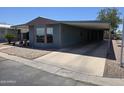 Inviting single-level home with a covered parking and easy-care rock garden at 3330 E Main St # 121, Mesa, AZ 85213