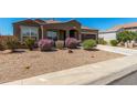 Inviting single-Gathering home with well-maintained desert landscaping and a spacious driveway at 38005 W Montserrat St, Maricopa, AZ 85138
