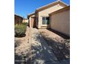 Inviting single-story home with a cozy entrance and landscaped front yard at 40047 N Cassara Dr, San Tan Valley, AZ 85140