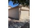 View of the home's exterior highlighting the two-car garage at 40047 N Cassara Dr, San Tan Valley, AZ 85140