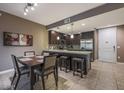 Eat-in kitchen featuring dark cabinets, stainless appliances and granite countertops at 5450 E Deer Valley Dr # 2191, Phoenix, AZ 85054