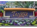 Community sign for Toscana of Desert Ridge surrounded by flowers and greenery at 5450 E Deer Valley Dr # 2191, Phoenix, AZ 85054