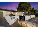 Charming single Gathering home with modern landscaping, decorative wall, and inviting curb appeal at 5707 N 12Th Pl, Phoenix, AZ 85014