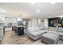Spacious open-concept living room and kitchen with stylish decor and modern finishes at 5707 N 12Th Pl, Phoenix, AZ 85014