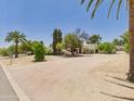 Attractive property boasts desert landscaping with mature trees for serene outdoor living and curb appeal at 5905 E Donna Ln, Paradise Valley, AZ 85253