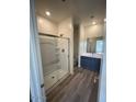 Modern bathroom featuring a glass shower, vanity with sink, and neutral-toned walls at 658 S Maricopa Rd, Florence, AZ 85132
