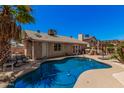 Inviting backyard pool with a patio area perfect for outdoor entertaining and relaxation at 7426 W Cholla St, Peoria, AZ 85345