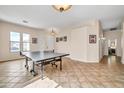Open game room with neutral walls, ample lighting, and tile floors at 8968 W Adam Ave, Peoria, AZ 85382