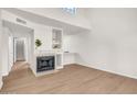 Spacious living room with fireplace, built-in shelves, and ample natural light at 1126 W Elliot Rd # 2023, Chandler, AZ 85224