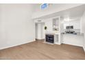 Bright living room featuring a fireplace, open floor plan, and modern finishes at 1126 W Elliot Rd # 2023, Chandler, AZ 85224