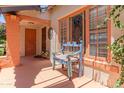 Inviting front porch featuring a colorful vintage bench with a charming exterior at 1134 W Portland St, Phoenix, AZ 85007
