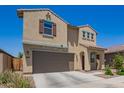 This is a charming two-story home featuring neutral stucco, a two-car garage, and a well-manicured front yard at 14180 W Willow Ave, Surprise, AZ 85379