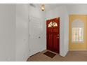 Bright entryway featuring a wood front door and neutral paint at 16002 E Gleneagle Dr, Fountain Hills, AZ 85268