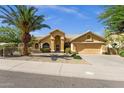 Inviting single-Gathering home with desert landscaping, a tile roof, and attached garage at 16002 E Gleneagle Dr, Fountain Hills, AZ 85268