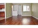 Inviting living room featuring sleek hardwood floors and neutral paint at 18250 N Cave Creek Rd # 123, Phoenix, AZ 85032