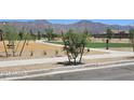Community playground featuring play structures, walking paths, and green spaces at 20756 N 224Th Ave, Surprise, AZ 85387