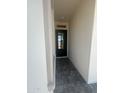 Welcoming entryway featuring a stylish black glass door and modern brick walkway at 3637 E Rochelle Cir, Mesa, AZ 85213
