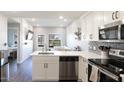 Modern kitchen featuring stainless steel appliances and sleek, white cabinetry at 475 N 9Th St # 303, Phoenix, AZ 85006
