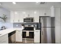 Bright kitchen with white cabinets, stainless steel appliances, and subway tile backsplash at 475 N 9Th St # 303, Phoenix, AZ 85006
