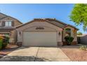 Inviting single-story home featuring a two-car garage and low-maintenance desert landscaping at 80 W Grey Stone St, San Tan Valley, AZ 85143
