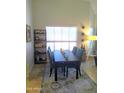 Bright dining room with modern table and chairs, complemented by natural light and stylish decor at 8700 E Mountain View Rd # 2029, Scottsdale, AZ 85258