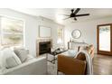 Inviting living room with cozy fireplace, comfortable seating, and ample natural light at 9224 E Windrose Dr, Scottsdale, AZ 85260