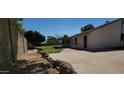 Large backyard with a covered patio, perfect for entertaining or relaxing in the shade at 949 N Ricardo N Cir, Mesa, AZ 85205