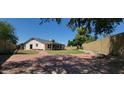 Spacious backyard with brick paved area, perfect for outdoor entertaining and relaxation at 949 N Ricardo N Cir, Mesa, AZ 85205