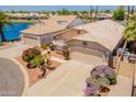 Charming home with a two-car garage, desert landscaping and a tile roof at 10526 W Tonopah Dr, Peoria, AZ 85382