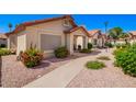 Landscaped front yard with desert flora around this neutral colored single story home at 1120 N Val Vista Dr # 113, Gilbert, AZ 85234