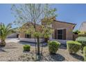 Charming home featuring desert landscaping with well-maintained shrubbery at 15655 W Berkeley Rd, Goodyear, AZ 85395