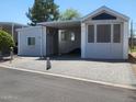 Charming single-story home featuring a covered parking and well-maintained landscaping in a peaceful neighborhood at 17200 W Bell Rd # 1279, Surprise, AZ 85374