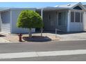 Charming single-story home featuring a covered parking and well-maintained landscaping in a peaceful neighborhood at 17200 W Bell Rd # 1279, Surprise, AZ 85374